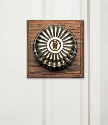 Fluted Brass Light Switch on Oak (118A)